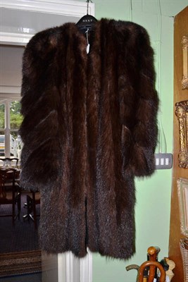 Lot 600 - A fur coat with chevron striped arms