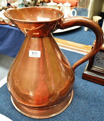 Lot 611 - A large copper jug engraved J Brown, Spirit Merchant