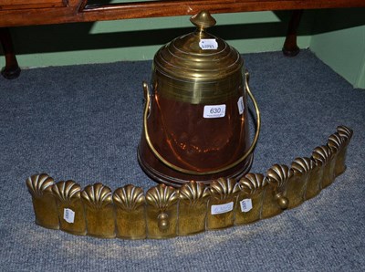 Lot 630 - A brass fire kerb and a copper brass vessel and cover