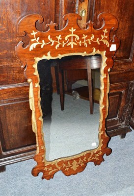 Lot 645 - A mahogany gilt fret cut mirror