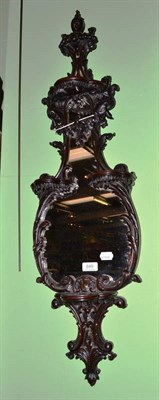 Lot 649 - A carved mahogany mirror with acanthus carved frame