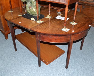 Lot 659 - A George III mahogany D-end table with two later additional leaves