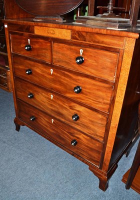 Lot 663 - A 19th century mahogany straight fronted chest with two short over three long drawers