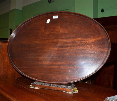 Lot 665 - A mahogany oval tray