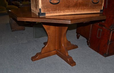 Lot 671 - An oak dining table