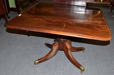 Lot 694 - Regency mahogany drop leaf table