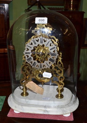 Lot 698 - A skeleton mantel timepiece beneath glass dome