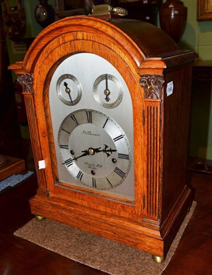 Lot 699 - A chiming oak mantel clock, JW Benson