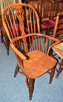 Lot 708 - 19th century Windsor crinoline armchair in yew and elm