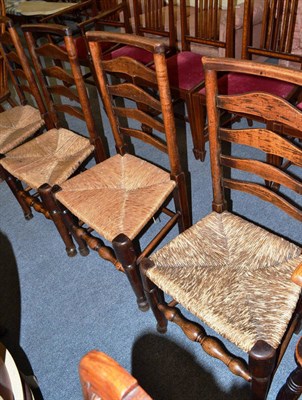 Lot 709 - Four 19th century ladder back and rush seated chairs