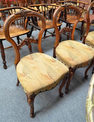 Lot 714 - Six Victorian walnut balloon back chairs