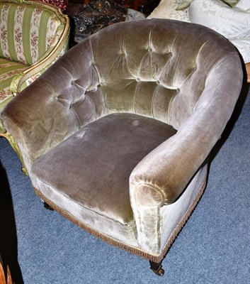 Lot 716 - An Edwardian tub shaped armchair upholstered in grey velvet