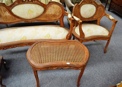 Lot 717 - French three piece suite with cane back support plus matching footstool