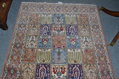 Lot 745 - Ghom part silk rug , Central Persia, The compartmentalised field of garden design within blood...