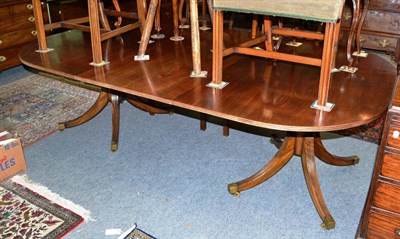 Lot 748 - A George III style twin-pedestal dining table, 20th century, of D shape form with reeded edge,...