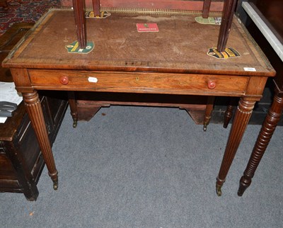 Lot 765 - A George IV rosewood writing table in the manner of Gillows with a fitted three quarter brass...