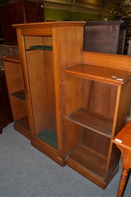 Lot 780 - A glazed oak gun cabinet with fitted shelves