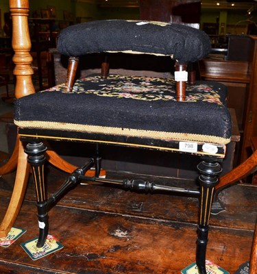 Lot 798 - A late 19th century ebonised dressing stool and a small footstool