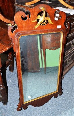 Lot 801 - An 18th century style mahogany and parcel gilt wall mirror