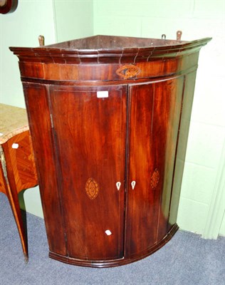 Lot 802 - A mahogany corner cupboard