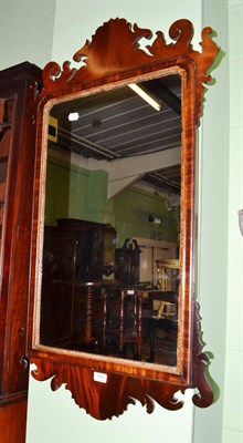 Lot 806 - A George III style mahogany and parcel gilt wall mirror