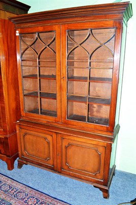 Lot 812 - A mahogany glazed bookcase fitted with two cupboard doors below