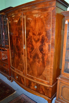 Lot 813 - Mahogany bow front wardrobe