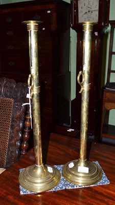 Lot 827 - Pair of tall brass adjustable candlesticks