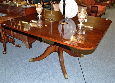 Lot 831 - A George III mahogany breakfast table, early 19th century, the broad rectangular top raised on...