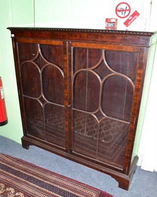 Lot 834 - A glazed mahogany display cabinet