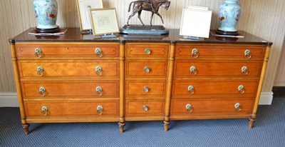 Lot 867 - American satin birch long chest of drawers