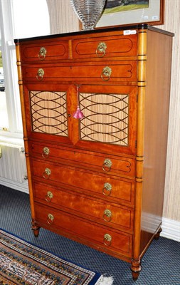 Lot 868 - American tall satin birch seven drawer chest fitted with two cupboard doors