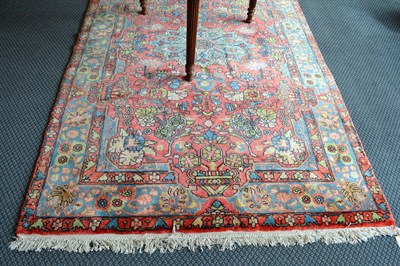 Lot 876 - Hamadan rug West Persia, The rose pink field of floral vines centred by a medallion enclosed by ice