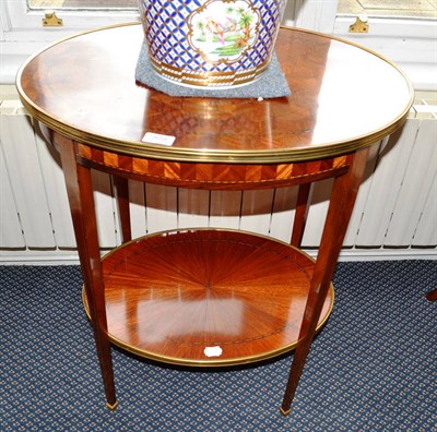 Lot 878 - French two-tier parquetry oval table with drawer