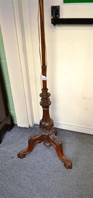 Lot 882 - A Victorian walnut pole screen converted to a lamp