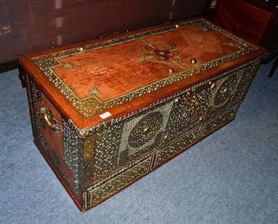 Lot 891 - A Zanzibar hardwood and brass bound chest, 20th century, decorated allover with studwork in...