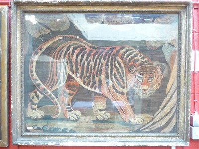 Lot 925 - An Early 19th Century woolwork picture depicting a tiger 82cm by 105cm excluding frame