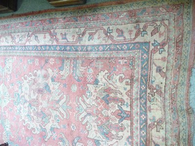 Lot 1102 - Ushak carpet Central Anatolia, The candy pink field with columns of medallions enclosed by...