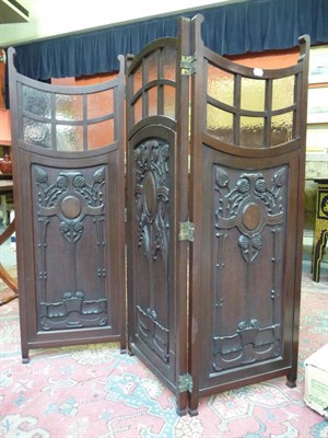 Lot 1103 - An Edwardian walnut three leaf screen