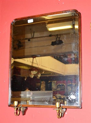 Lot 1112 - A mirror with twin sconces