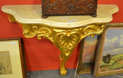 Lot 1114 - A gilt gesso and marble console table in early 18th century style