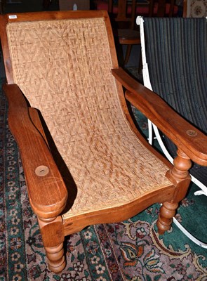 Lot 1120 - A hardwood steamer chair