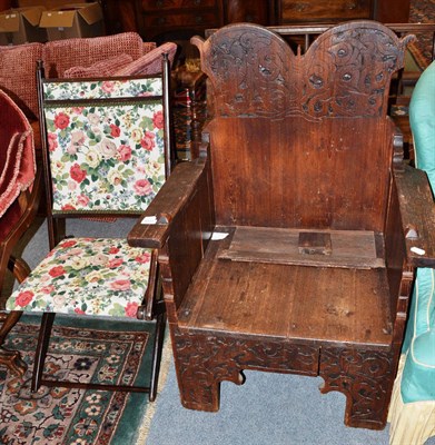 Lot 1131 - A carved and stained Spanish style armchair and an early 20th century folding armchair