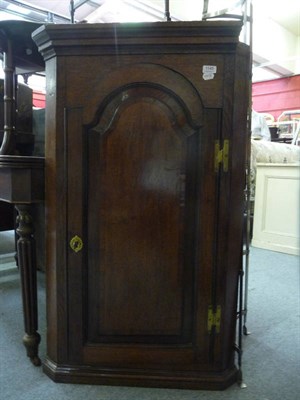 Lot 1145 - An 18th century oak and mahogany crossbanded corner cupboard