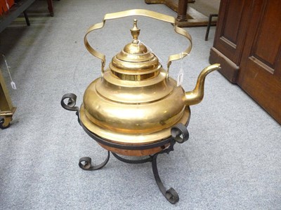 Lot 1153 - A brass kettle and stand