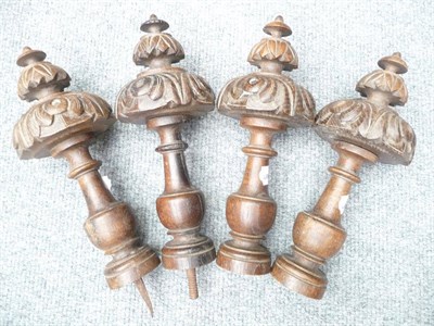 Lot 1154 - A set of four carved oak cornice pole finials