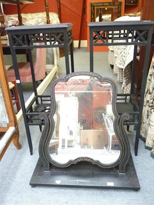 Lot 1193 - An ebonised swing toilet mirror and a pair of ebonised plant stands