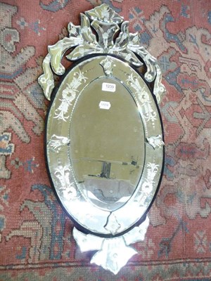 Lot 1239 - A Venetian style oval wall mirror