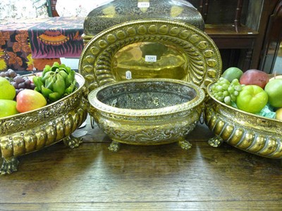 Lot 1241 - Three Dutch oval brass jardinières and an oval dish