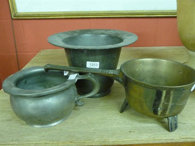 Lot 1253 - Two pewter pots and a brass skillet